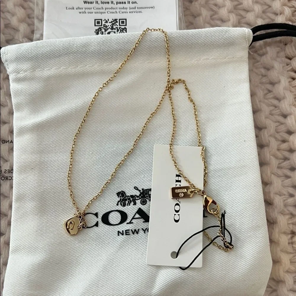 Coach Necklace with Heart-Shaped Pendant - Gold